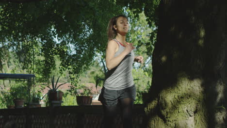 young woman jogging in the park slow motion