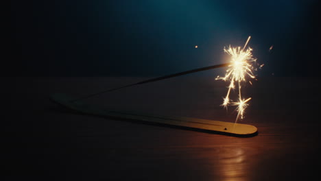 a sparkler burn in the dark room