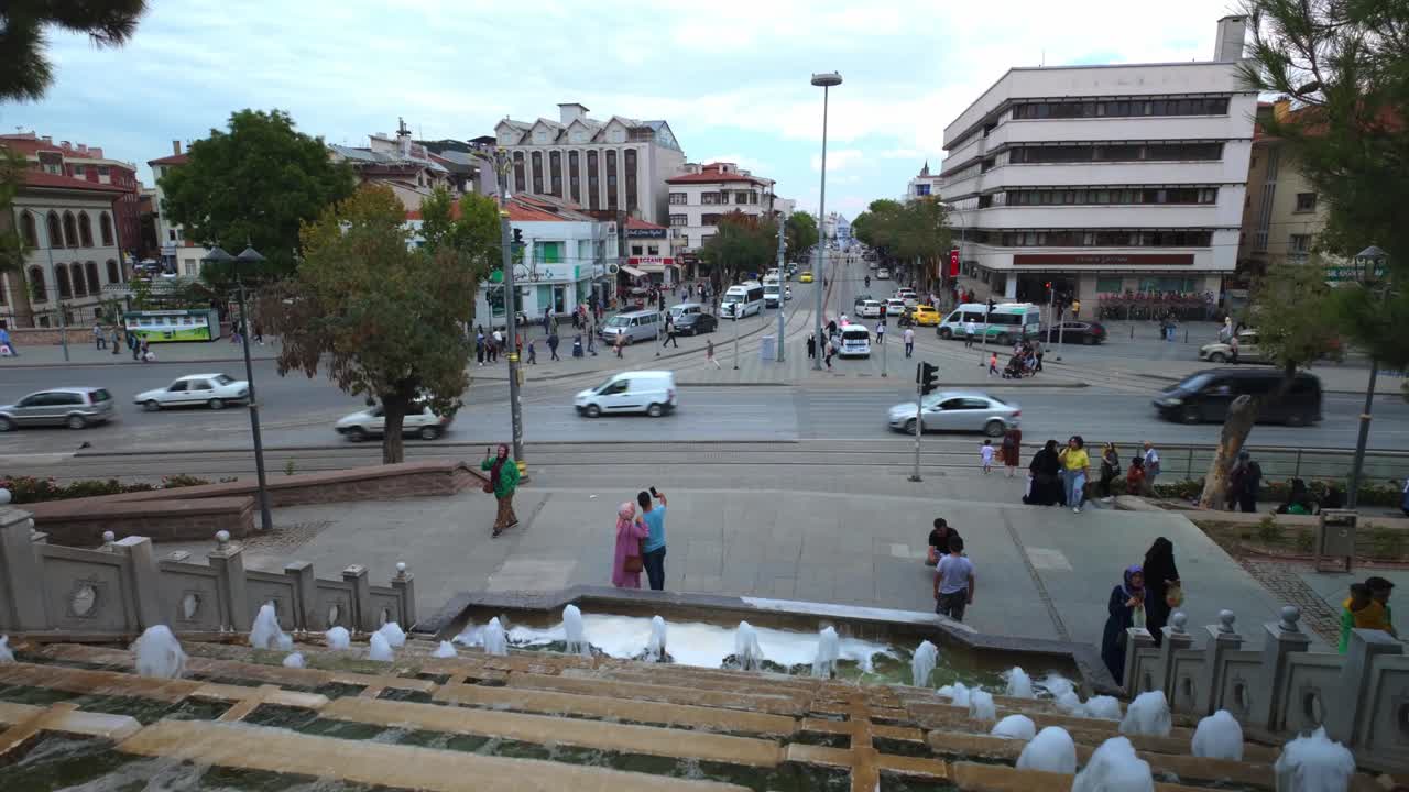 People enjoying the peaceful atmosphere and greenery in a Konya park, a serene place for relaxation in Turkey