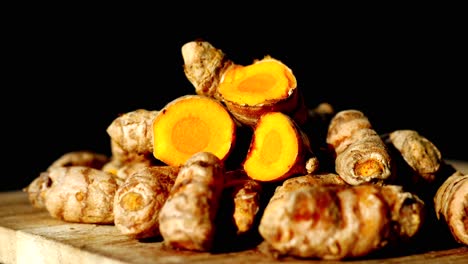 Detail-shot-of-turmeric-root-in-bowl-on-table