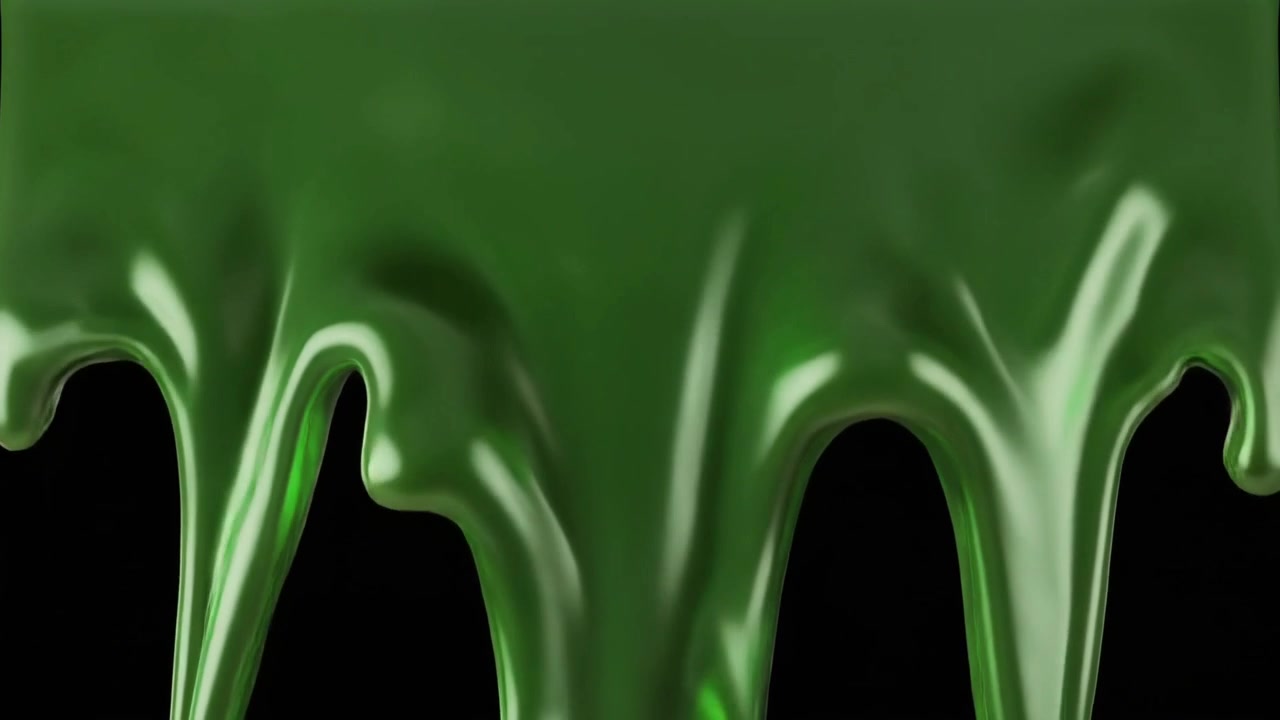 Dikke groene vloeistof druipend tegen een zwarte achtergrond