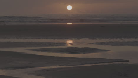 sunrise or sunset on a calm beach