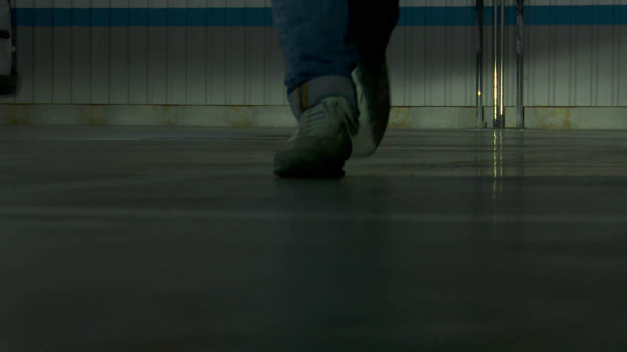 Person walking in a parking garage