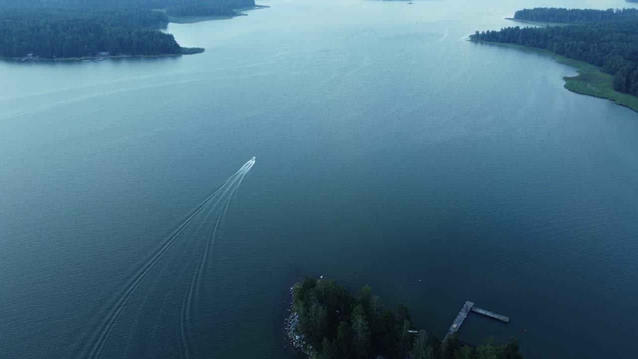 Aerial view of a lake with a boat