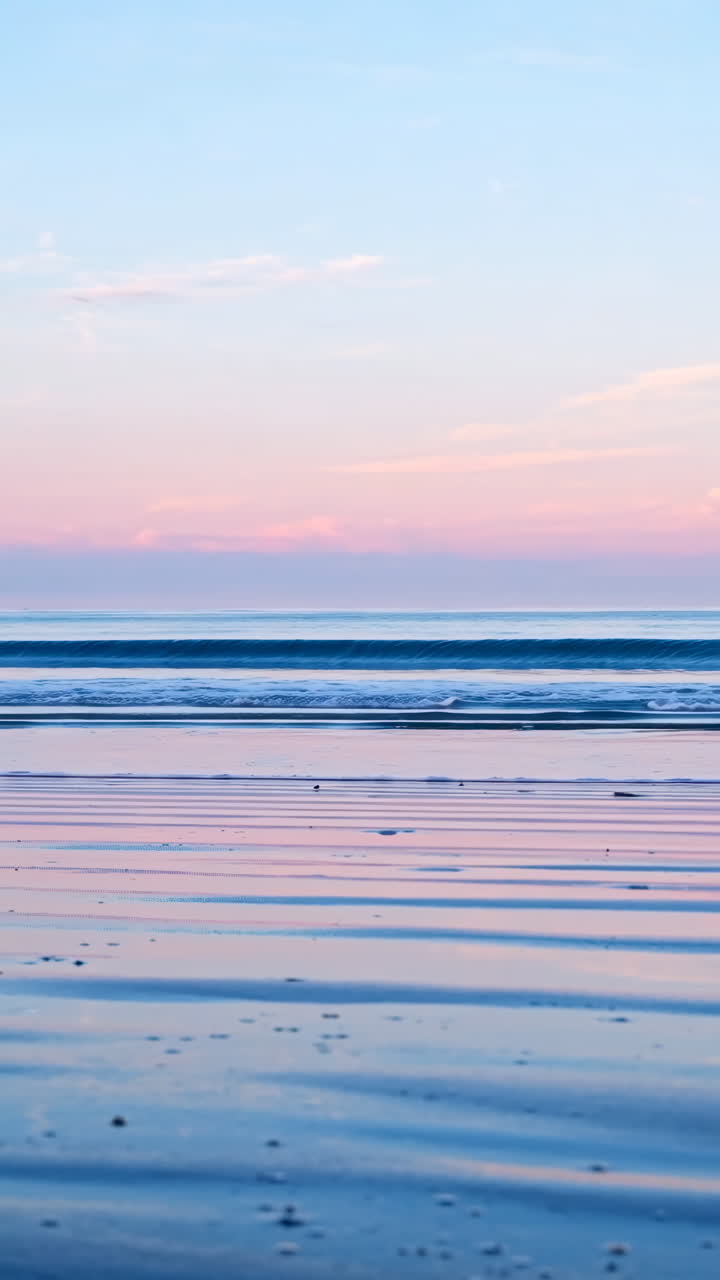 Pastel Sunrise or Sunset over a Calm Ocean Beach