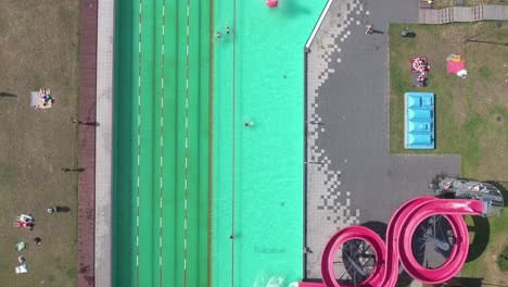 bird eye view of swimming pool with people having fun