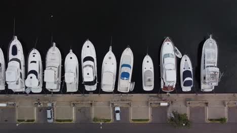 zenithal aerial view of yachts parked at private pier