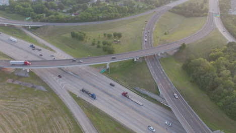 aerial drone footage rotating around the highway 153 and interstate 75 interchange in chattanooga, tn during the golden hour sunset
