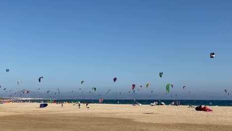 many people practicing kitesurf in the beach of tarifa punta paloma.