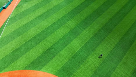 Lone-person-strolling-across-grass-carpet-of-Brooklyn-Cyclones-Stadia