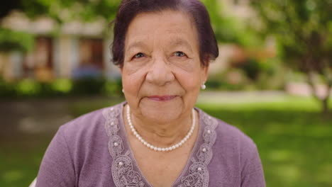 senior woman, face or thinking in nature park