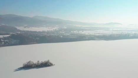 Snow-covered-Field-With-Mountain-Range-On-The-Background-In-Bird-Island