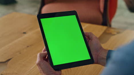 greenscreen pad manager hands holding office close up. man reading mockup screen