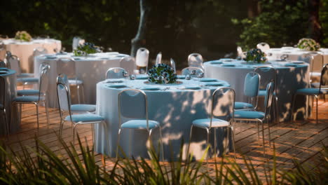 empty wicker table and chair in outdoor restaurant forest garden