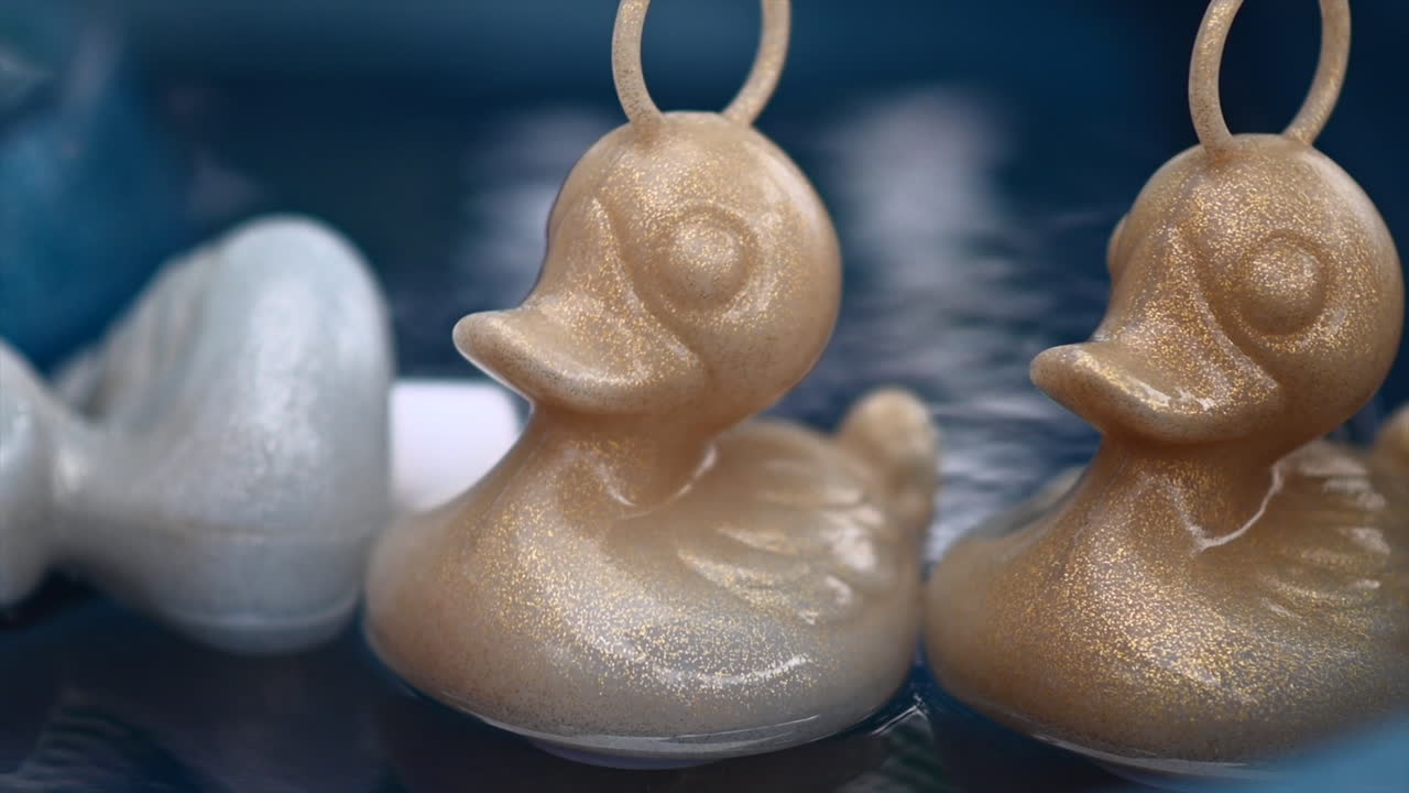 Rubber duck toys moving on water container