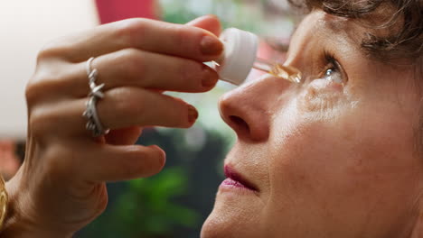 elderly woman applying serum and lotion on her face for anti aging daily routine