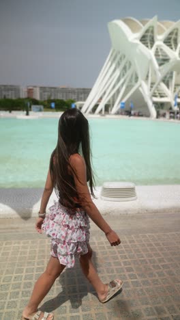 girl in front of the city of arts and sciences in valencia