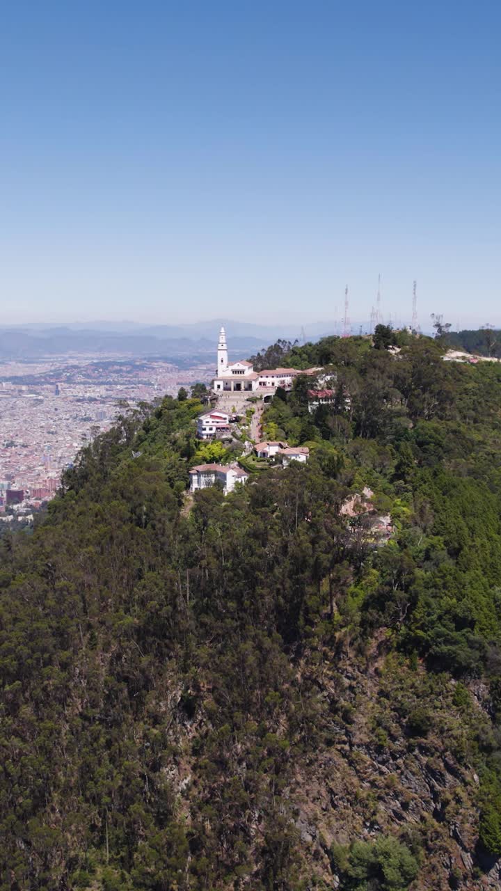 Aerial view of the Monserrate church and Bogota cityscape in Colombia. Vertical Video