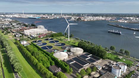 waste water treatment plant in the port of rotterdam, along the meuse river. cleanign water. utility in industrial port area. the netherlands. aerial view.