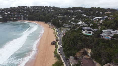 Aerial-view-of-a-small-seaside-town-expensive-homes-built-on-the-cliff