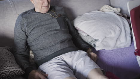 senior man relaxing on a couch