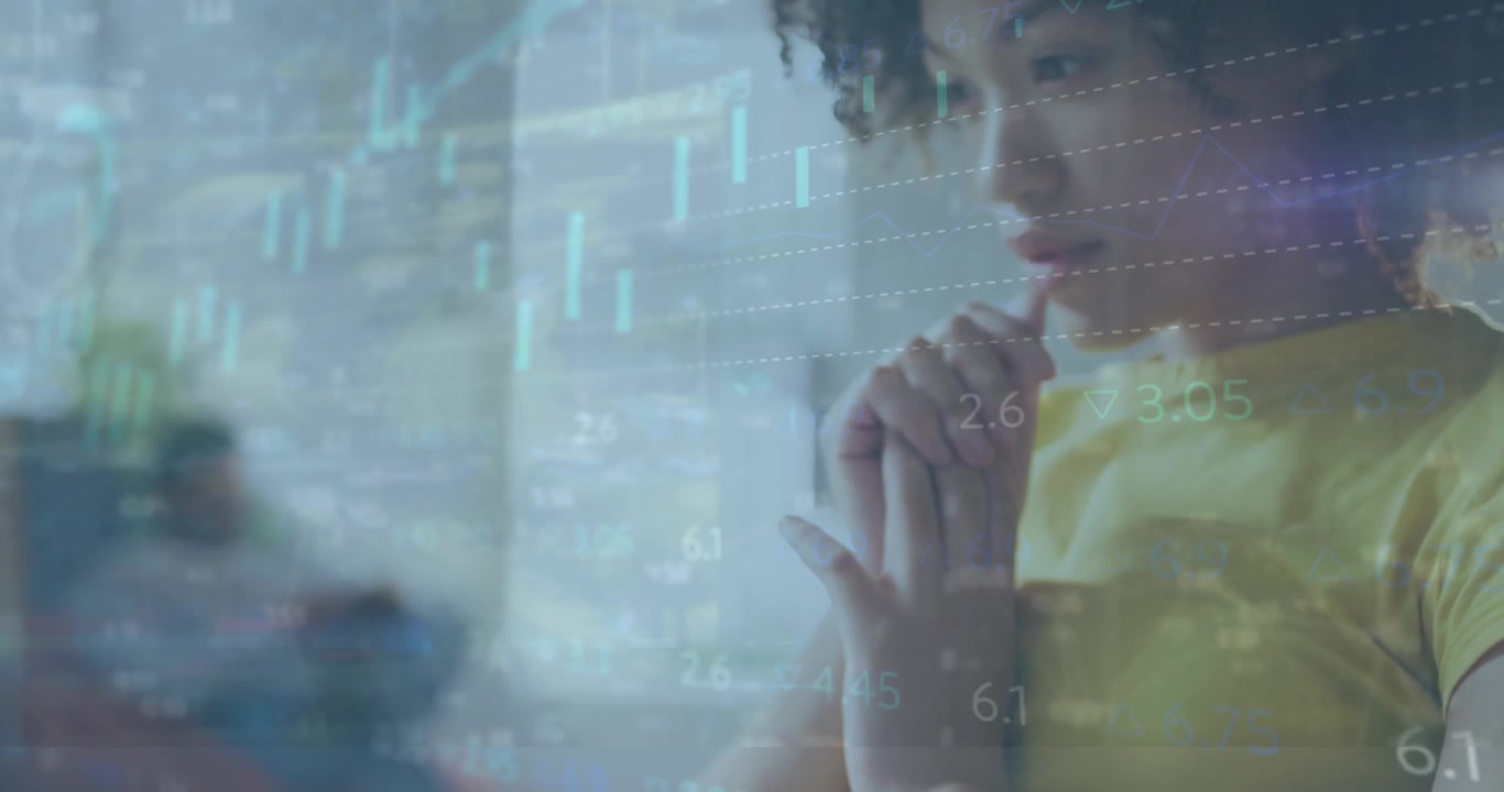 Young Woman Analyzing Financial Data on Laptop in Office