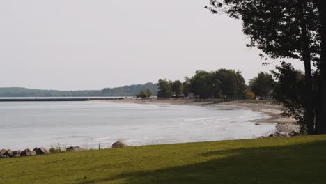 slow motion shot of the light house and shore at sodus point new york vacation spot at the tip of land on the banks of lake ontario