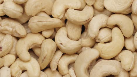 smooth camera movement over a handful of cashew nuts.