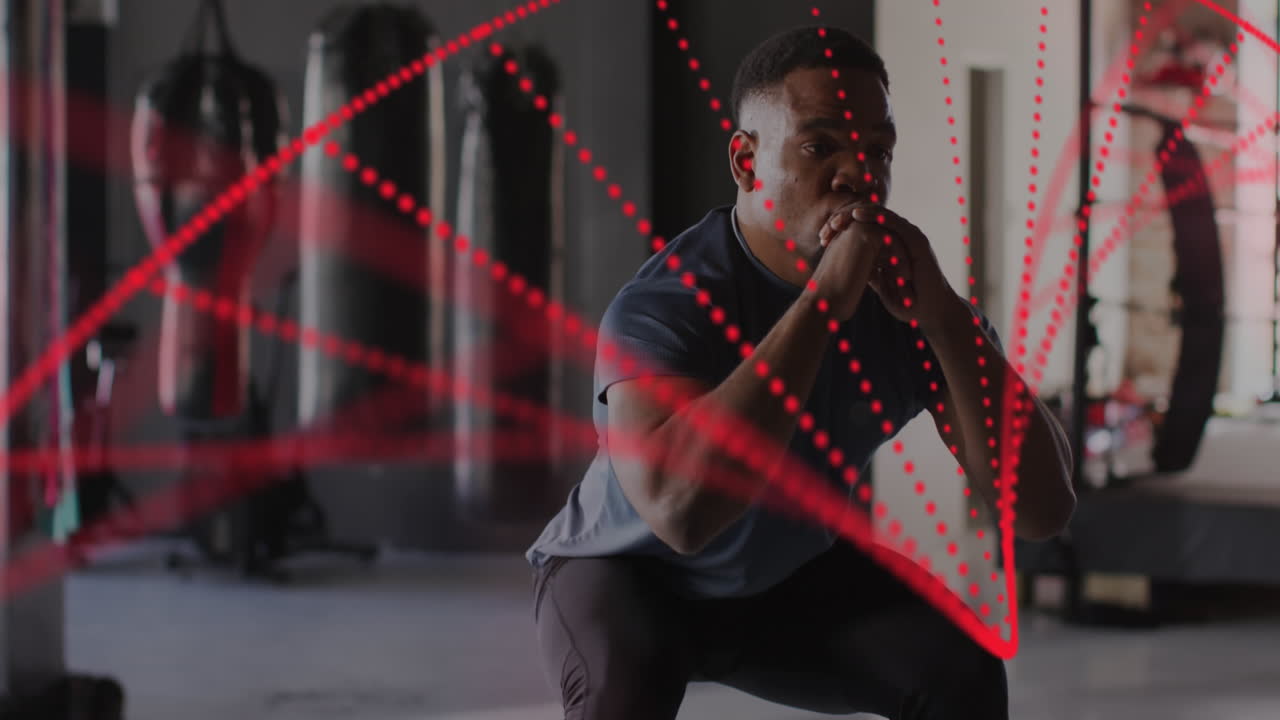 체육관에서 운동하는 아프리카계 미국인 남성 위의 dna  ⁇ 의 애니메이션