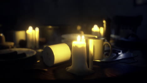 warm candlelight illuminates a cozy dining setting during an intimate dinner
