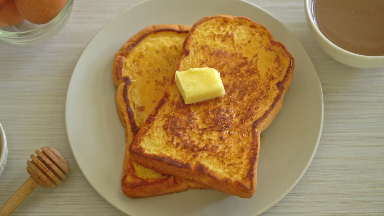 French toasted with butter and honey for breakfast