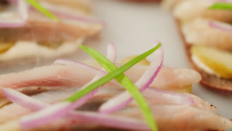 smoked fish sandwiches with onions and herbs