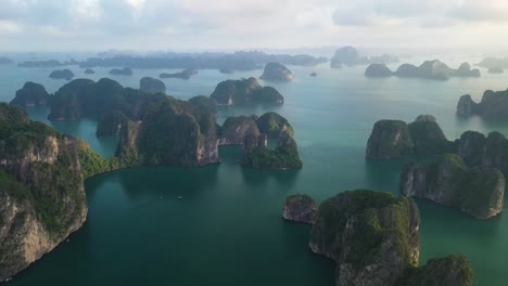 breathtaking aerial view of bai tu and ha long bay unesco world heritage vietnam , famous scenic archipelago and sea at evening, drone shot