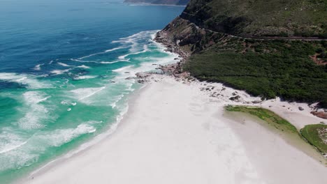 Slow-motion-view-of-calm-and-quite-sea-beside-huge-mountain-green-cliffs