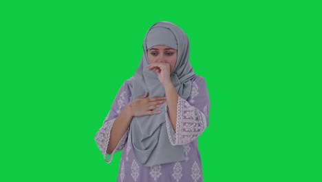 Sick-Muslim-woman-suffering-from-Fever-Green-screen