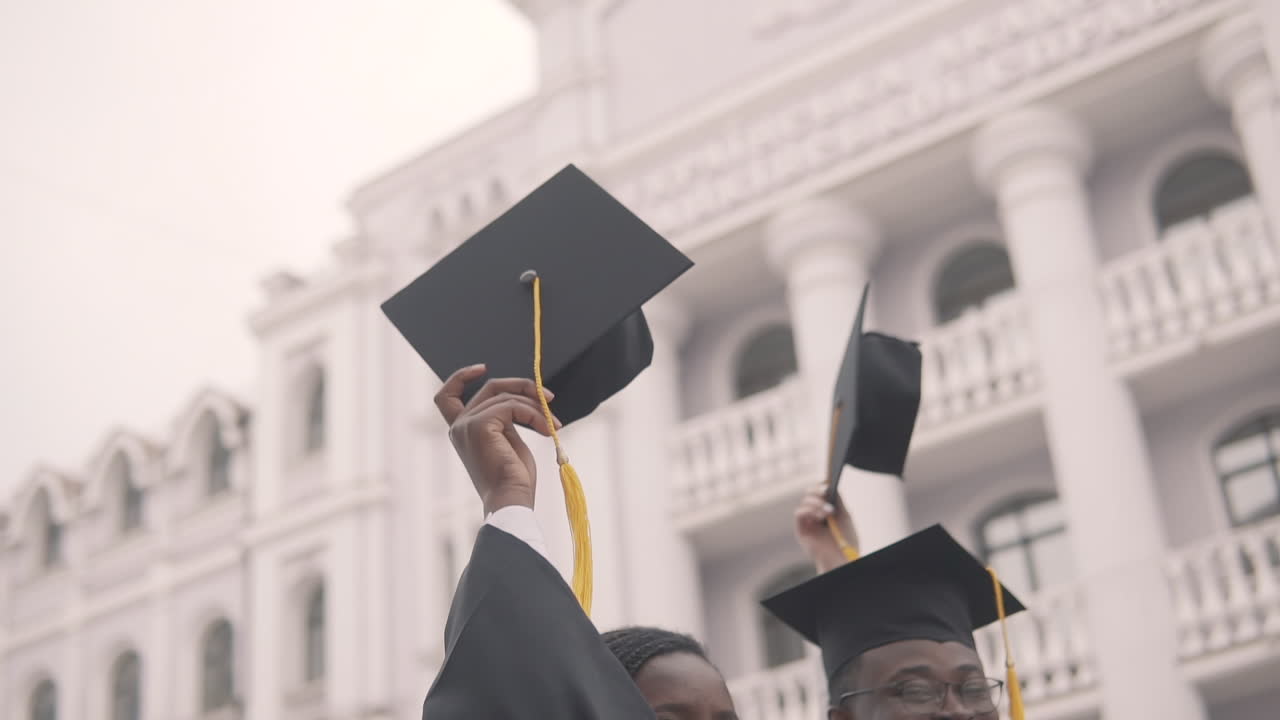 Graduation Cap Flapped In The Hands Of A Black Female Graduate