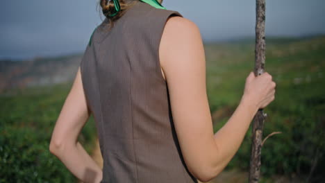 portrait adventure girl posing on outdoor journey. fashion woman holding stick