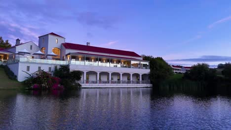 drone shot of asara wine restaurant in front of lake