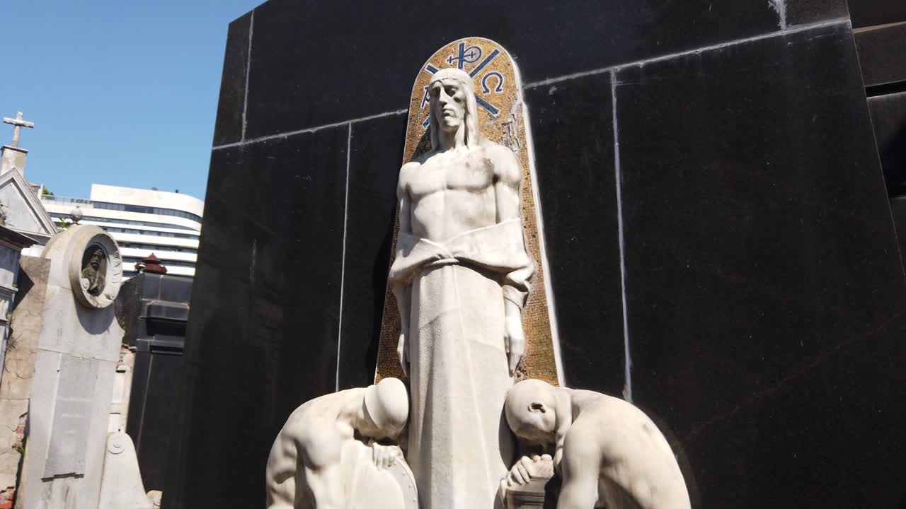 Details of Recoleta Cemetery with Jesus Christ and Faithful Prayer Statues
