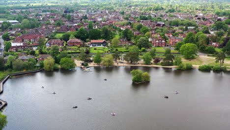 Aerial-flying-over-Petersfield-Heath-Pond-Sunny-day-UK-4K