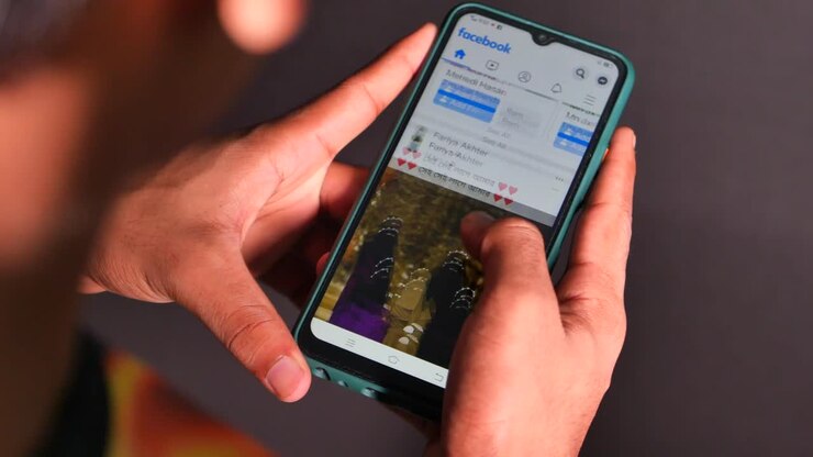 Person using a Facebook mobile application