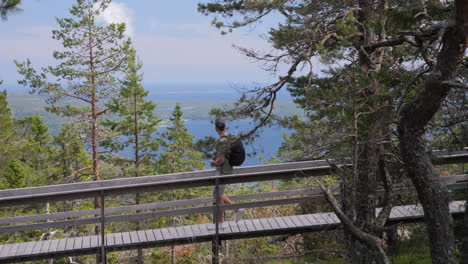 person walking and taking picture on nature hiking walk outdoors