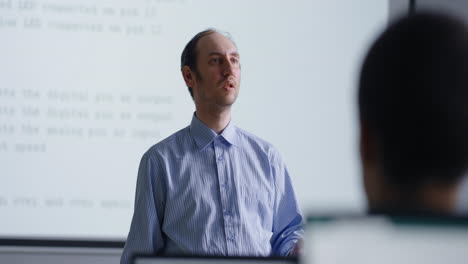 teacher giving a lecture in a classroom