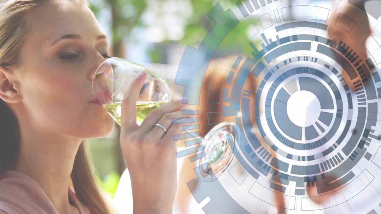 Female lifting wine glass outdoor cafe swirling starting rotating overlay showing technology fusion