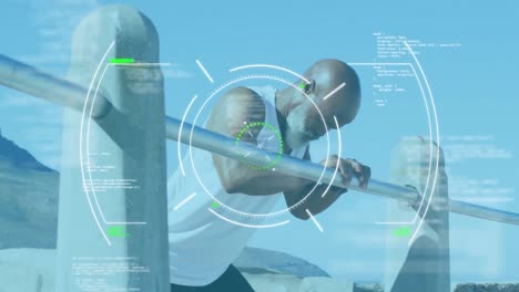 Animation-of-scope-scanning-over-senior-african-american-man-exercising-at-beach