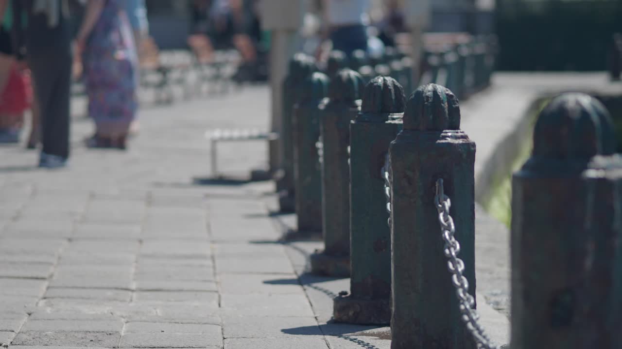 City park walkway with metal posts and chains