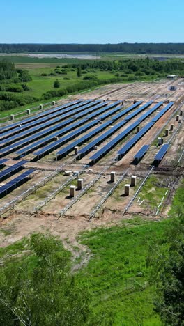 aerial view of solar farm set in a rural landscape on a bright, clear day in latvia