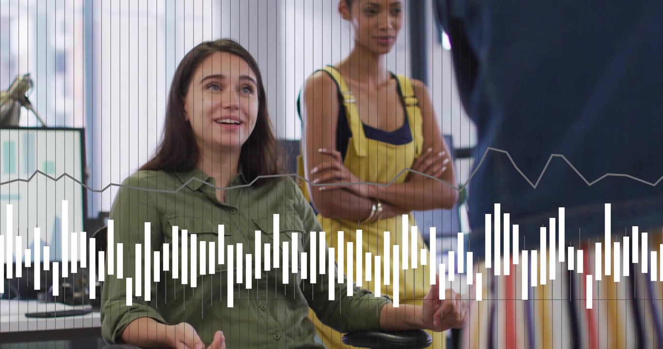 Seated woman responding to colleague question and gesturing in business meeting with audio waveform