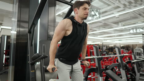 Sporty-Man-Doing-Dips-Exercise-Training-Chest-on-Horizontal-Bars-at-Health-Center