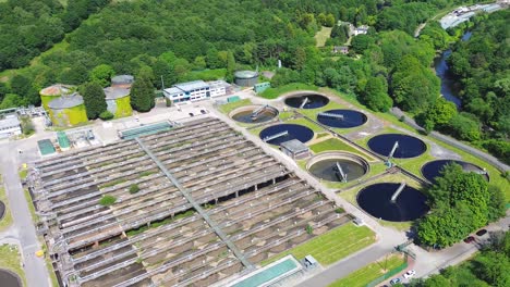 aerial top view of circular ponds in wastewater treatment plant and filtration of dirty sewage water